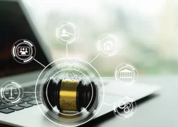 A laptop with a judge's gavel on it, navigating data privacy fines.