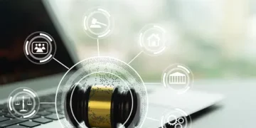 A laptop with a judge's gavel on it, navigating data privacy fines.