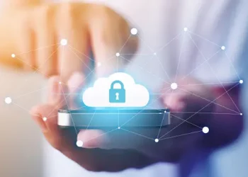 Person using smartphone, cloud with padlock icon, digital security and Zelle payment protection. - Supply Chain News