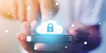 Person using smartphone, cloud with padlock icon, digital security and Zelle payment protection. - Supply Chain News