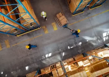 CarParts.com expands operations with a larger Las Vegas warehouse, boosting efficiency. Aerial view of workers.