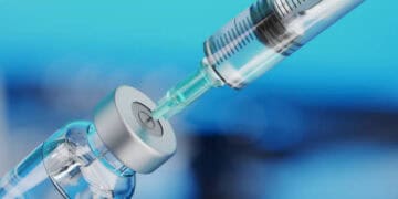 A vaccine syringe is being inserted into a syringe for exporting to Indonesia.