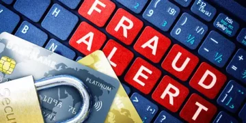 Credit cards, padlock, and keyboard displaying "FRAUD ALERT". Beware of delayed disconnect scams targeting Canadian bank customers. - Supply Chain News