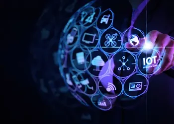 An image of a businessman engaged in a digital transformation, touching an icon on a screen.