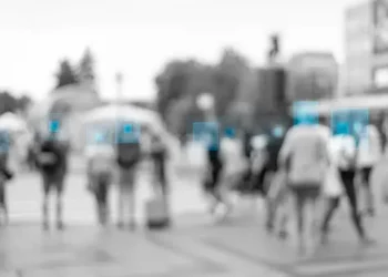 Blurred crowd of people, facial recognition boxes highlight individuals. Concerns over facial recognition in Myanmar. - Supply Chain News