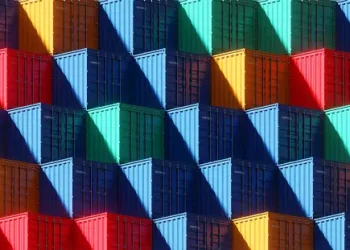 A vibrant display of shipping containers on a wall, showcasing the creativity and innovation of the Manufacturing 4.0 Initiative in Iowa.