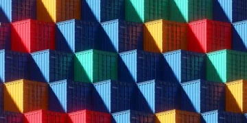 A vibrant display of shipping containers on a wall, showcasing the creativity and innovation of the Manufacturing 4.0 Initiative in Iowa.