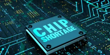 A Motorola chip with the word chip storage on top of a circuit board, amidst the semiconductor shortages, leading to increased costs.
