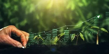 Hand planting seeds, growth chart superimposed, illustrating supply chain growth. - Supply Chain News