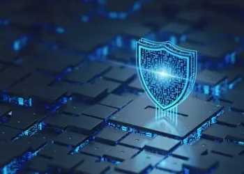 An image of a shield symbolizing cybersecurity, set against a blue background.