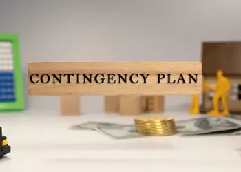 A wooden sign with the word contingency plan on it, reflecting the importance of resilience and risk analysis in supply chain strategies.