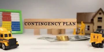 A wooden sign with the word contingency plan on it, reflecting the importance of resilience and risk analysis in supply chain strategies.