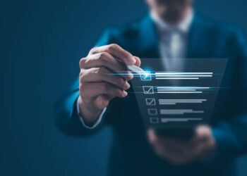 Businessperson checking items on a digital checklist. - Supply Chain News