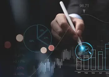 A man in a suit is holding a pen in front of an efficiency graph.