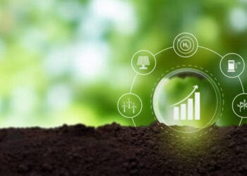 Growing graph with icons representing renewable energy sources and global trade, symbolizing economic growth. - Supply Chain News