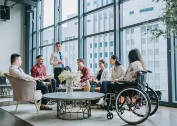 Diverse business team meeting, showcasing ethical leadership in a modern office. - Supply Chain News