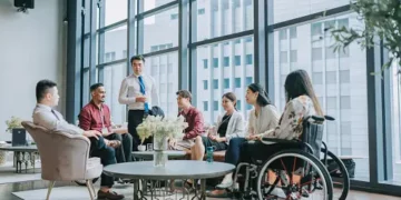 Diverse business team meeting, showcasing ethical leadership in a modern office. - Supply Chain News