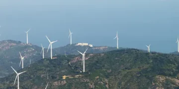 Wind turbines on a hill overlooking the ocean captivated President Biden and US Tech Executives at the Innovation and Investment Summit.