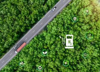 Aerial view of highway with hydrogen fuel cell vehicles, illustrating the global energy market transformation. - Supply Chain News