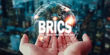 Two people holding the BRICS word, with Xi Jinping, the Chinese President.