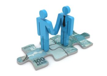 Two people from different countries symbolizing international cooperation, holding hands on a puzzle piece representing regional development at the Eastern Economic Forum.