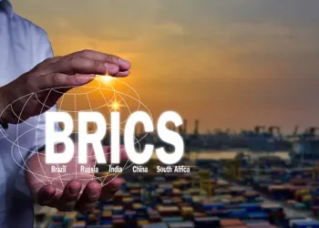 A vibrant screen displays the word "BRICS" alongside a majestic ship, symbolizing the global summit held in Johannesburg.
