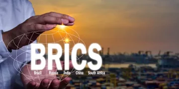 A vibrant screen displays the word "BRICS" alongside a majestic ship, symbolizing the global summit held in Johannesburg.