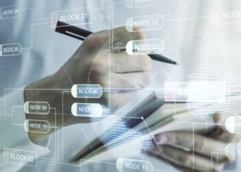 Person analyzing data on a tablet, Shanghai lockdown economic impact. - Supply Chain News