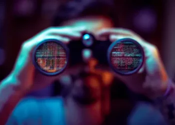 Person using binoculars, lenses filled with blurred code. Alleged spyware investigation in India. - Supply Chain News