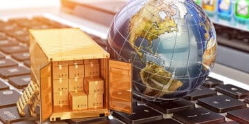 Global trade: shipping container on laptop with world globe, symbolizing international commerce and Russia's expanding trade with Africa. - Supply Chain News