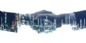 Handshake overlaid with image of Pakistan's industrial infrastructure, symbolizing geo-economic growth and regional connectivity. - Supply Chain News
