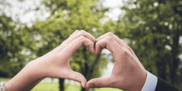 Co-Founder Emily Abraham of World of Love Luxury captured a beautiful moment as a bride and groom explored their love by creating a heart shape with their hands.