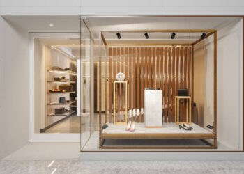 Luxury boutique storefront display with shoes and accessories. Shift in consumer spending trends reflected in high-end retail. - Supply Chain News
