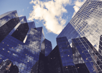 Modern glass skyscrapers reflecting clouds in Montreal, Canada. Royalmount development. - Supply Chain News