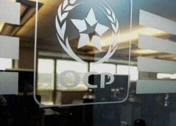 OCP Group logo on glass door. Moroccan phosphate fertilizer. - Supply Chain News