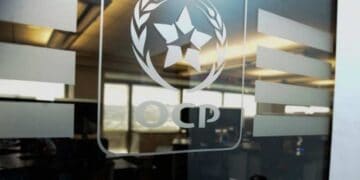 OCP Group logo on glass door. Moroccan phosphate fertilizer. - Supply Chain News