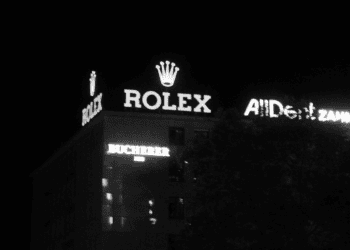 Nighttime view of a Bucherer building with prominent Rolex signage. - Supply Chain News