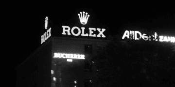 Nighttime view of a Bucherer building with prominent Rolex signage. - Supply Chain News