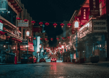 Night view of Chinatown street, red lanterns, and shops like Canton Bazaar. - Supply Chain News