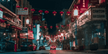 Night view of Chinatown street, red lanterns, and shops like Canton Bazaar. - Supply Chain News