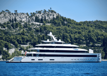 Luxury superyacht at sea near a rocky coastline. Monaco drone delivery. - Supply Chain News