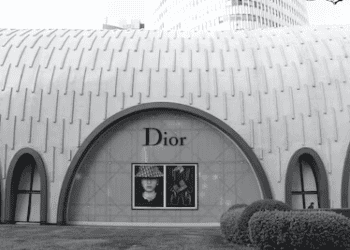 A black and white photo showcasing the elegance of a dior store, catering to the luxury market trends.