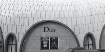 A black and white photo showcasing the elegance of a dior store, catering to the luxury market trends.