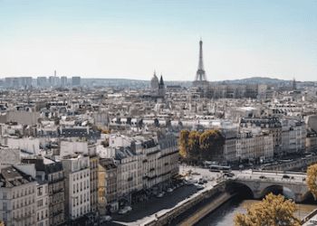 Paris cityscape view with Eiffel Tower in distance, showcasing Parisian architecture and shopping opportunities. - Supply Chain News