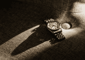 A luxury watch sitting on a couch.