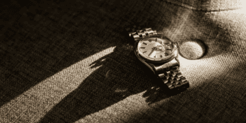 A luxury watch sitting on a couch.
