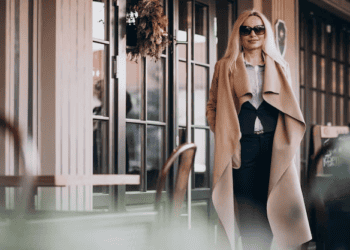 Stylish millennial woman in a beige coat, redefining luxury. - Supply Chain News