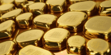 A row of rare metal gold bars, subject to China's export restrictions, are carefully arranged.