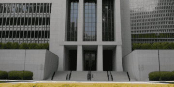 The hong kong stock exchange building in hong kong is an important hub for global growth and faces economic challenges.