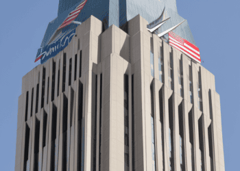 A tall building with an American flag on top, settles with Bank of America for $250 million.